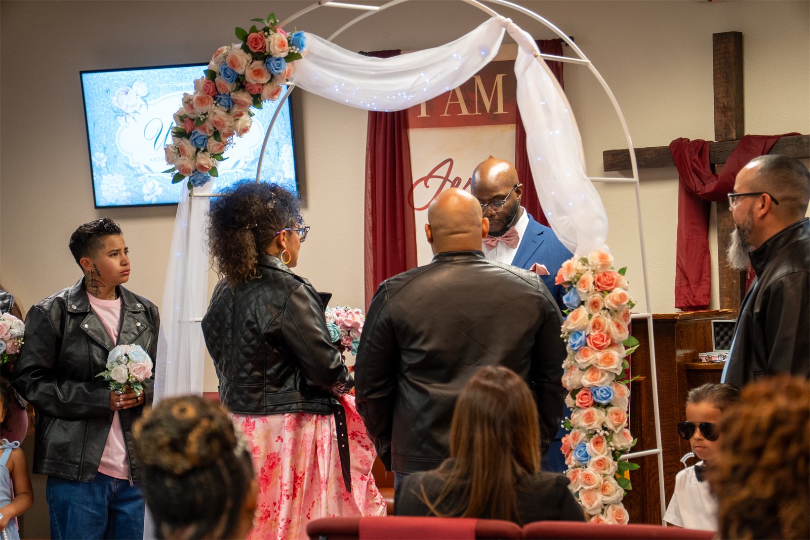 Wide view of the ceremony with guests seated