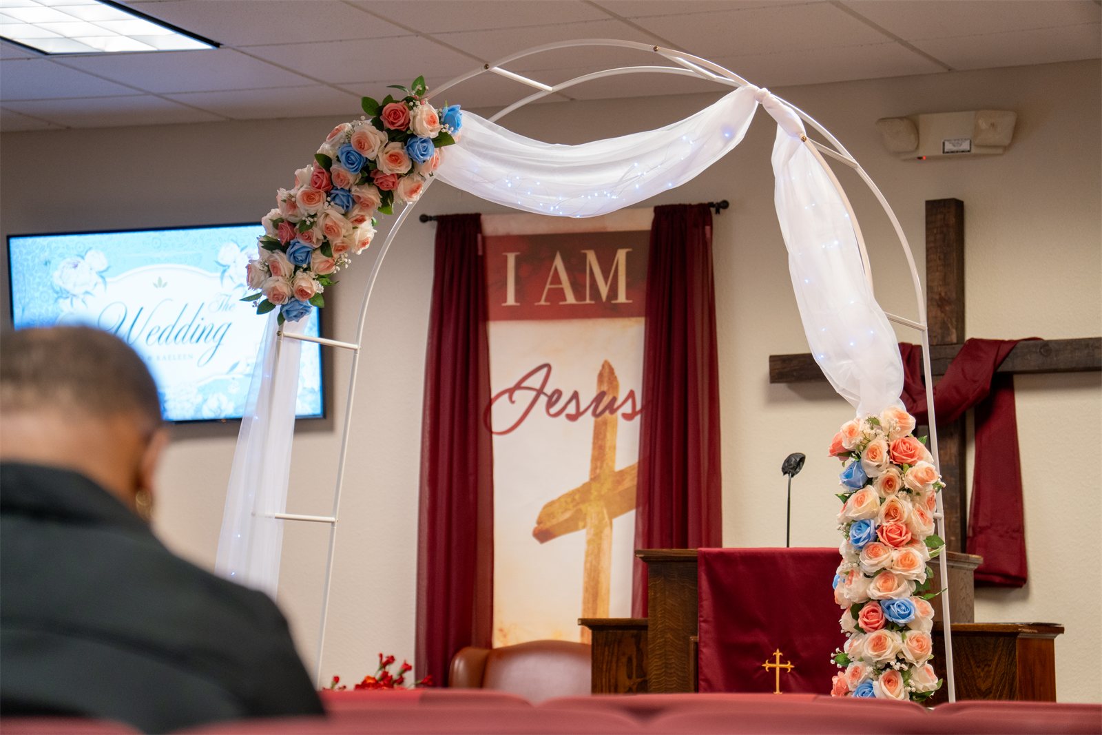 Draped arch and altar set for the ceremony